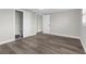 Empty bedroom with wood style floors, white walls, and a closet in view at 13411 Lisa Dr, Hudson, FL 34667