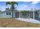 Inviting single-story home with a well-manicured lawn, covered entry, and a convenient carport at 13411 Lisa Dr, Hudson, FL 34667