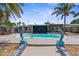 A luxurious pool surrounded by lush greenery, perfect for relaxing and entertaining at 13411 Lisa Dr, Hudson, FL 34667