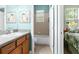 Cozy bathroom featuring a tub/shower and a classic vanity with tasteful decor at 14145 Citrus Way, Brooksville, FL 34601