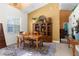 Dining room boasts a large wood table, area rug, natural light and built-in shelving for displaying decorative items at 14145 Citrus Way, Brooksville, FL 34601