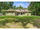 Charming single-story home with a spacious front yard and mature trees at 14145 Citrus Way, Brooksville, FL 34601
