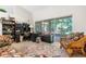 Bright living room with a slider to the patio overlooking lush landscaping bringing the outdoors in at 14145 Citrus Way, Brooksville, FL 34601