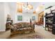 Inviting living room with natural light, comfortable seating, and a view into the dining area at 14145 Citrus Way, Brooksville, FL 34601
