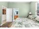 The main bedroom features an attached bathroom and calming green color scheme at 14145 Citrus Way, Brooksville, FL 34601