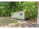 Well-maintained outbuilding, perfect for storage or a workshop, set in a tranquil, wooded setting at 14145 Citrus Way, Brooksville, FL 34601