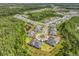 Aerial view of a residential neighborhood showcases well-kept lawns and mature trees along a tree lined cul-de-sac at 16793 Forge Surf St, Land O Lakes, FL 34638