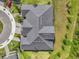 Aerial view of the gray roof and green landscaping around the house at 16793 Forge Surf St, Land O Lakes, FL 34638