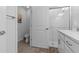 Modern bathroom featuring a glass-enclosed shower, sleek sink, and a convenient toilet in a clean design at 16793 Forge Surf St, Land O Lakes, FL 34638