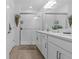 Elegant bathroom with a glass-enclosed shower, double sinks, modern fixtures, and stylish decorative accents at 16793 Forge Surf St, Land O Lakes, FL 34638