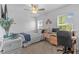 Bright bedroom with neutral walls, carpet and a ceiling fan above the bed at 16793 Forge Surf St, Land O Lakes, FL 34638