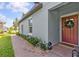 Close-up of the front door and the nicely landscaped walkway at 16793 Forge Surf St, Land O Lakes, FL 34638