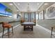 Modern game room with a pool table, stylish lighting, and comfortable seating at 16793 Forge Surf St, Land O Lakes, FL 34638