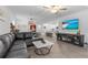 Open-concept living space showcasing the kitchen, dining area, and a comfortable living room setup at 16793 Forge Surf St, Land O Lakes, FL 34638