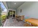 Inviting covered patio with a table, chairs, and stylish outdoor decor at 16793 Forge Surf St, Land O Lakes, FL 34638