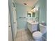 Bathroom with a white sink, toilet, cabinets, and neutral tiled floor at 18109 Webster Grove Dr, Hudson, FL 34667