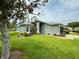 Well-manicured lawn complements this home's exterior at 18109 Webster Grove Dr, Hudson, FL 34667