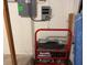 View of a generator with 5000 watts power along with the electrical panel at 18109 Webster Grove Dr, Hudson, FL 34667