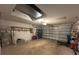 Well lit two-car garage featuring an automatic door and concrete floors at 18109 Webster Grove Dr, Hudson, FL 34667