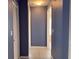 Hallway with neutral paint, white trim, and views to the other parts of the home at 18109 Webster Grove Dr, Hudson, FL 34667