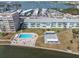 Community featuring pool, lounging, and lounging areas, plus view of the adjacent waterway at 1847 Shore S Dr # 203, South Pasadena, FL 33707