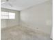 Spacious bedroom with a window, offering potential for customization and comfort at 1847 Shore S Dr # 203, South Pasadena, FL 33707