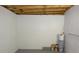 Unfinished basement featuring painted walls, concrete floor and exposed wooden ceiling at 18838 Rosephil St, Spring Hill, FL 34610