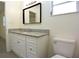 Bathroom featuring a large vanity with granite countertops and a modern mirror at 18838 Rosephil St, Spring Hill, FL 34610