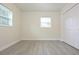 Bedroom featuring new floors, fresh paint, and a large closet at 18838 Rosephil St, Spring Hill, FL 34610