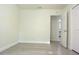 Empty bedroom featuring modern flooring and view into adjoining space at 18838 Rosephil St, Spring Hill, FL 34610