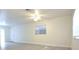 Spacious living area featuring neutral paint, vinyl floors, and window views at 18838 Rosephil St, Spring Hill, FL 34610