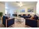 Stylishly furnished living room featuring modern decor, a cozy sofa, and elegant rug at 18838 Rosephil St, Spring Hill, FL 34610