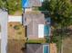 Aerial view of a single-Gathering home boasting a fenced pool in a tranquil residential neighborhood at 2192 Meredith Dr, Spring Hill, FL 34608