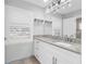 Modern bathroom with granite countertop and custom cabinets provides style and functionality at 2192 Meredith Dr, Spring Hill, FL 34608
