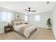 Spacious bedroom featuring a ceiling fan, windows, and neutral decor at 2192 Meredith Dr, Spring Hill, FL 34608