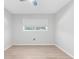 Bright, airy bedroom with a large window, creating a serene and inviting space at 2192 Meredith Dr, Spring Hill, FL 34608