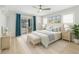Beautiful bedroom with king bed, walk-out access, ceiling fan, and matching nightstands at 2192 Meredith Dr, Spring Hill, FL 34608