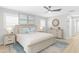 Coastal-style bedroom with king bed, soft blue accents, and calming decor at 2192 Meredith Dr, Spring Hill, FL 34608