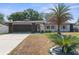 Charming one-story home with a well-manicured lawn and a spacious driveway at 2192 Meredith Dr, Spring Hill, FL 34608