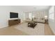 Bright living room featuring neutral furniture, modern decor and hardwood floors at 2192 Meredith Dr, Spring Hill, FL 34608