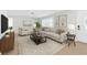 Bright living room featuring neutral furniture, modern decor and hardwood floors at 2192 Meredith Dr, Spring Hill, FL 34608