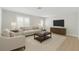 Bright living room featuring neutral furniture, modern decor and hardwood floors at 2192 Meredith Dr, Spring Hill, FL 34608
