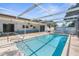 Inviting screened-in pool with a spacious lanai, perfect for outdoor relaxation and entertaining at 2192 Meredith Dr, Spring Hill, FL 34608