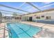 Sparkling screened-in pool with a spacious patio, ideal for outdoor fun and entertainment at 2192 Meredith Dr, Spring Hill, FL 34608