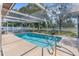 Sparkling screened-in pool, perfect for swimming and enjoying the beautiful backyard at 2192 Meredith Dr, Spring Hill, FL 34608