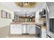 Updated kitchen with stainless steel appliances, wood countertops, and an open layout to the living room at 2292 Wyndam Dr, Spring Hill, FL 34606