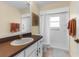 Clean bathroom with a white vanity, walk-in shower, and neutral color scheme at 261 Rochester St, Spring Hill, FL 34609