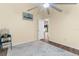 Comfortable bedroom featuring a ceiling fan, wood floors, and view to the hallway at 261 Rochester St, Spring Hill, FL 34609
