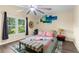 Lovely bedroom with a vaulted ceiling, a bright window, and a cozy seating area at 261 Rochester St, Spring Hill, FL 34609
