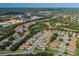 Aerial view showcasing the property's location within a residential neighborhood with mature trees and winding streets at 284 Quane Ave, Spring Hill, FL 34609